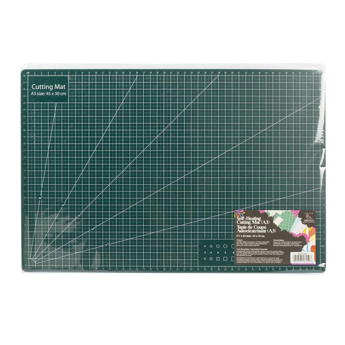 Green cutting mat with grid lines on a white background
