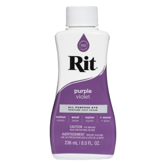Bottle of Rit dye in purple violet color on a white background