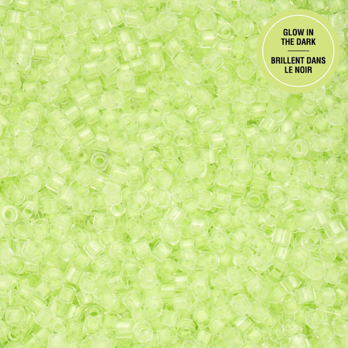 Close-up of green beads with 'Glow in the Dark' text on a green background