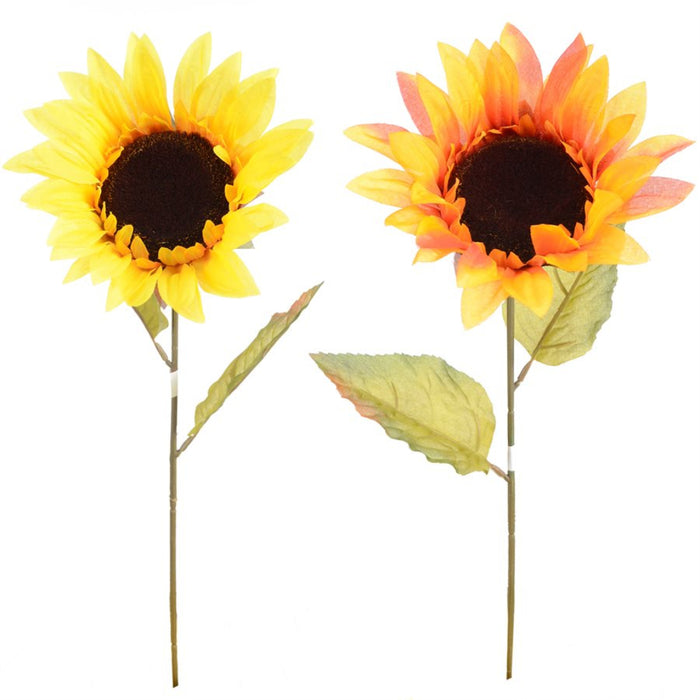 Two artificial sunflower stems on a plain white background, one with bright yellow petals and one with yellow-to-orange fading petals, both with dark brown centers and green leaves.