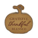 A decorative wooden pumpkin-shaped sign with the words 'GRATEFUL thankful BLESSED' in brown lettering, shown on a plain white background.
