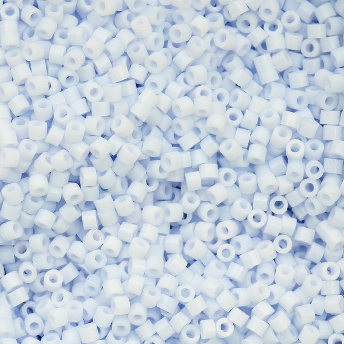 Close-up of light blue pony beads on a light blue background