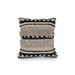 A square decorative throw pillow with a textured, woven horizontal striped pattern in beige, cream, and black, featuring fringe details on the sides.