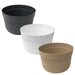 Set of three round ribbed plastic storage tubs in black, white, and tan – assorted colors.