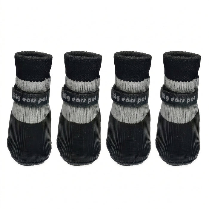 Four black and gray knit pet booties arranged in a row on a white background, each with a black strap labeled 'Big ears pet'.