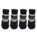 Four black and gray knit pet booties arranged in a row on a white background, each with a black strap labeled 'Big ears pet'.