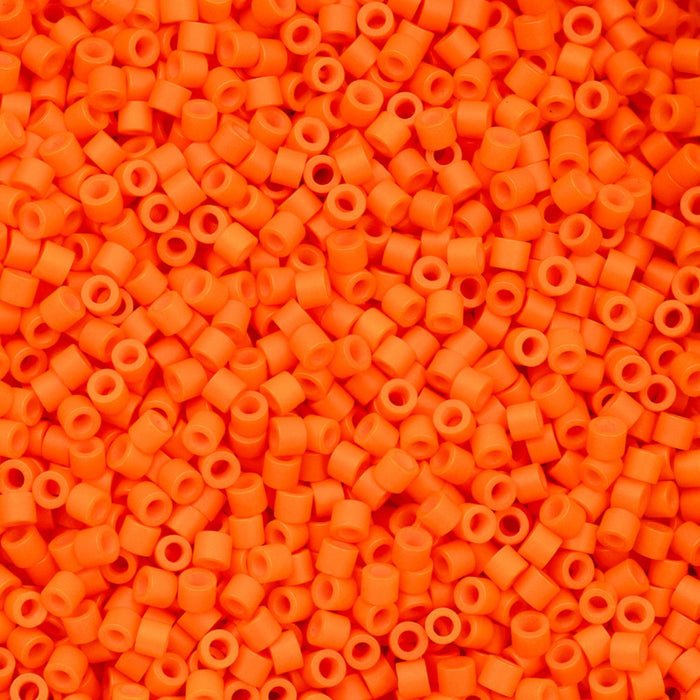 Close-up of a pile of bright orange plastic beads