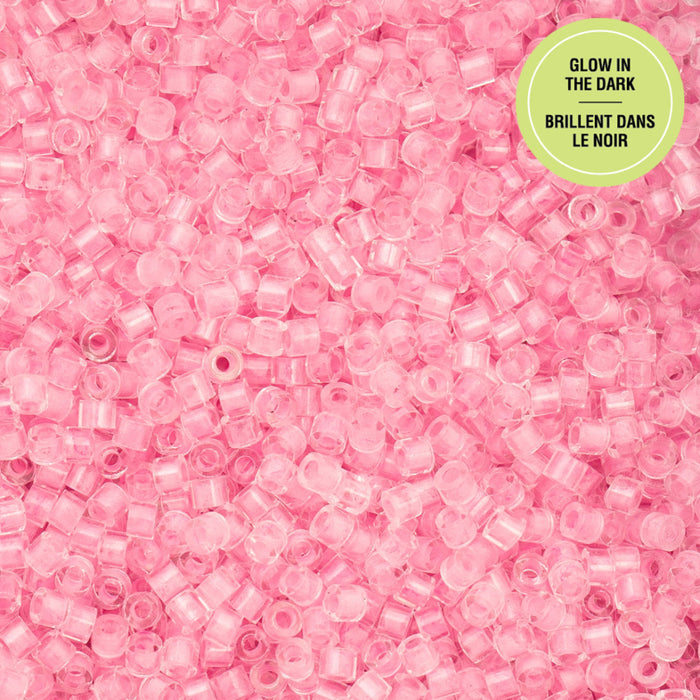 Pink glow-in-the-dark beads with a green label on a pink background