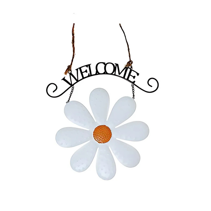 Hanging welcome sign with a large white metal daisy and orange center beneath a black scroll-style “WELCOME” text.