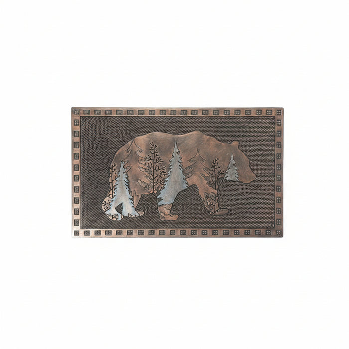Rectangular decorative wall plaque featuring a raised bear silhouette filled with pine trees, set on a dark textured background with a patterned border.