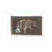 Rectangular decorative wall plaque featuring a raised bear silhouette filled with pine trees, set on a dark textured background with a patterned border.