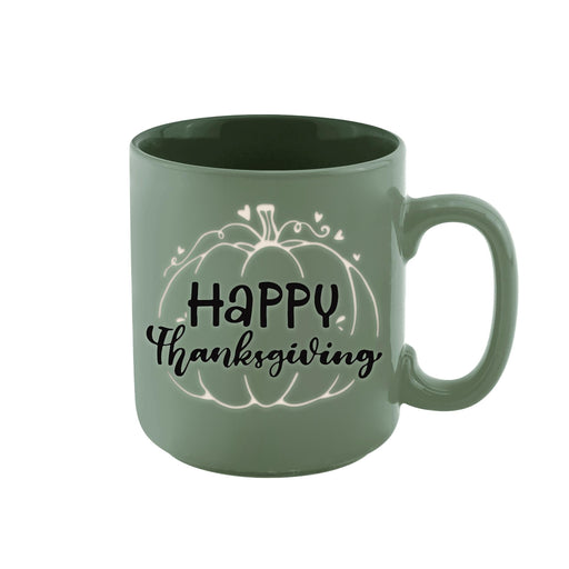 A sage green ceramic mug with a 'Happy Thanksgiving' pumpkin graphic printed on the side, set against a plain white background.