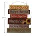 A rustic multi-layered wooden hanging sign with Thanksgiving-themed phrases including 'GIVE THANKS', 'Happy Harvest', 'Gather Together', 'Blessings', 'All Are Welcome', and 'THANKSGIVING'. The sign has a black height measurement marker on the left side indicating 11.