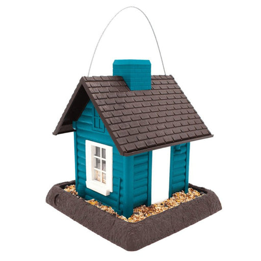Blue birdhouse with brown roof and white window on a white background