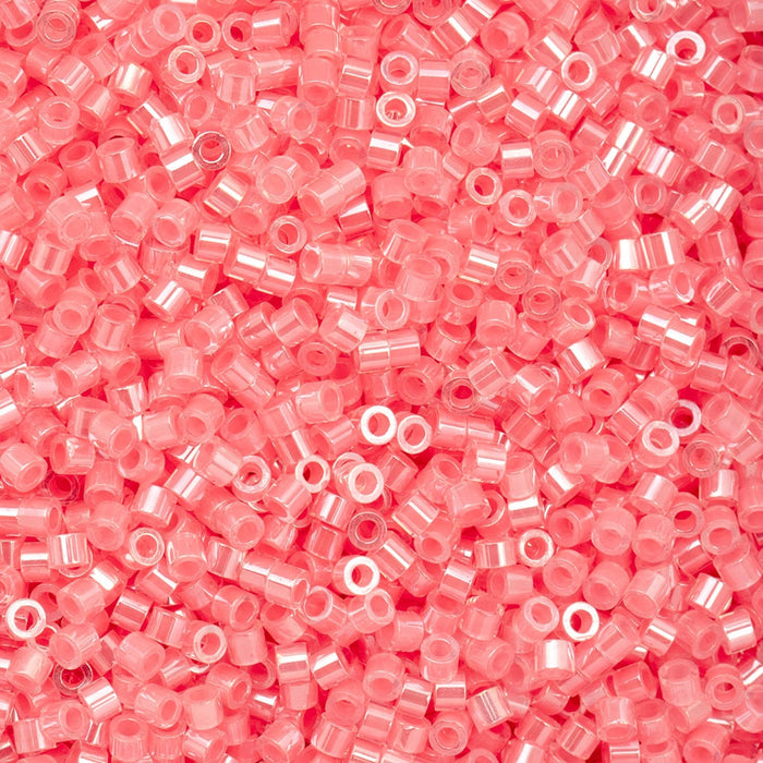 Close-up of pink glass beads with a pink background
