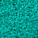 Turquoise plastic beads densely packed together