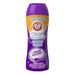 A 510g bottle of Arm & Hammer Clean Scentsations In-Wash Scent Booster with Odour Blasters in the Fresh Burst scent, featuring a purple and yellow design.