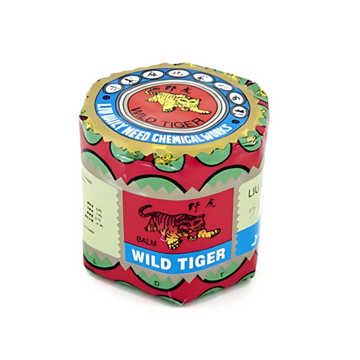 Round red-and-gold wrapped container of Wild Tiger Therapy Balm with tiger illustrations and multilingual labeling.