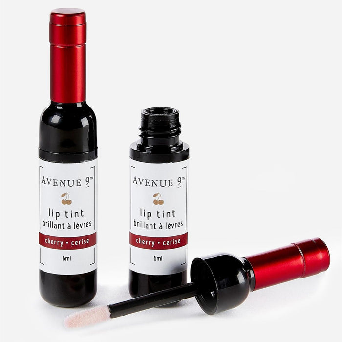 Two bottles of Avenue 9 lip tint with a brush on a white background