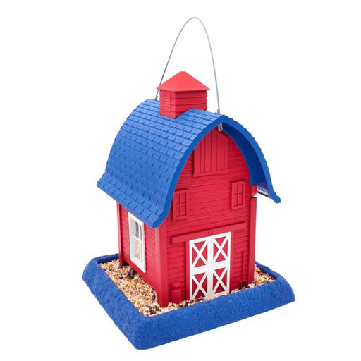 Red and blue birdhouse with a white door on a white background