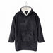 A black fleece hooded robe with a white sherpa-lined hood, featuring a dark gray deer and snowflake pattern on the front, a kangaroo pocket, and a metal hanger.
