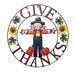 A circular autumn-themed sign with the words 'GIVE THANKS' in dark red lettering, surrounding a scarecrow, sunflowers, green leaves, and red pumpkins on a white background.