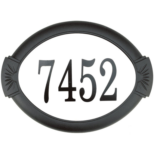 Black house number plate with '7452' on a white background