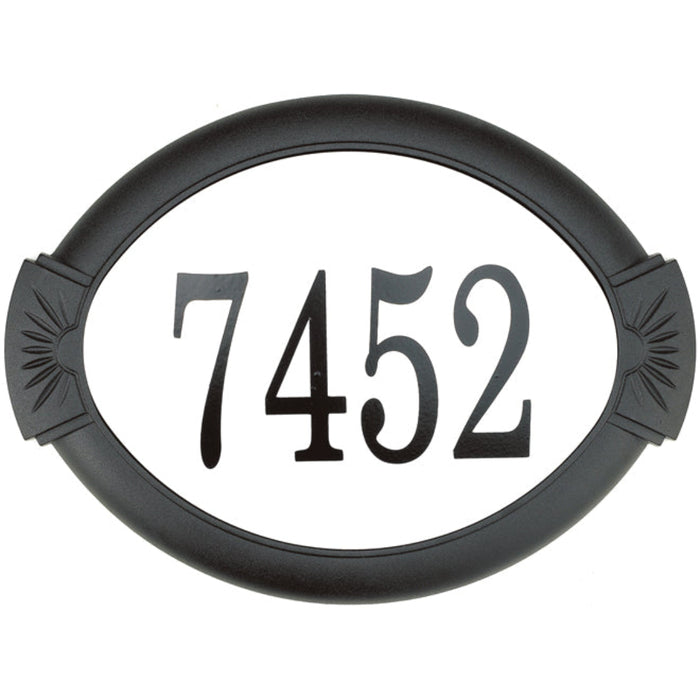 Black house number plate with '7452' on a white background