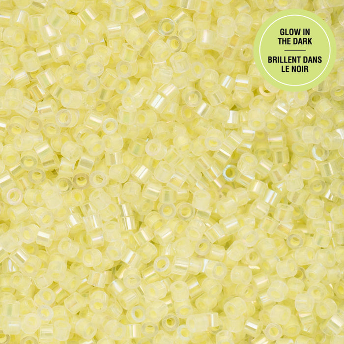Close-up of glow-in-the-dark yellow beads with a label in the corner.