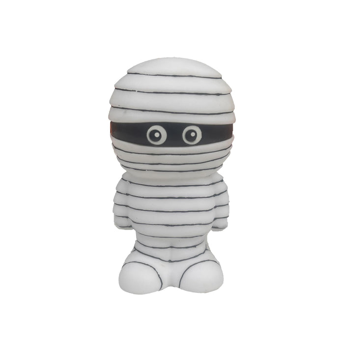 A white and black mummy toy figure with large cartoon eyes, standing against a plain white background.