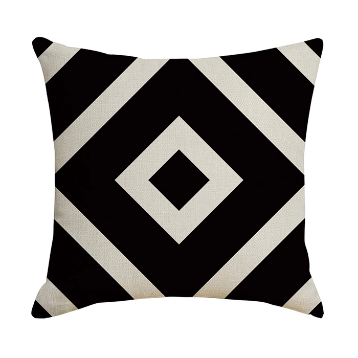 Decorative pillow with black and white geometric pattern on a white background