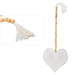 Decorative heart-shaped hanging with wooden beads and tassels on a white background