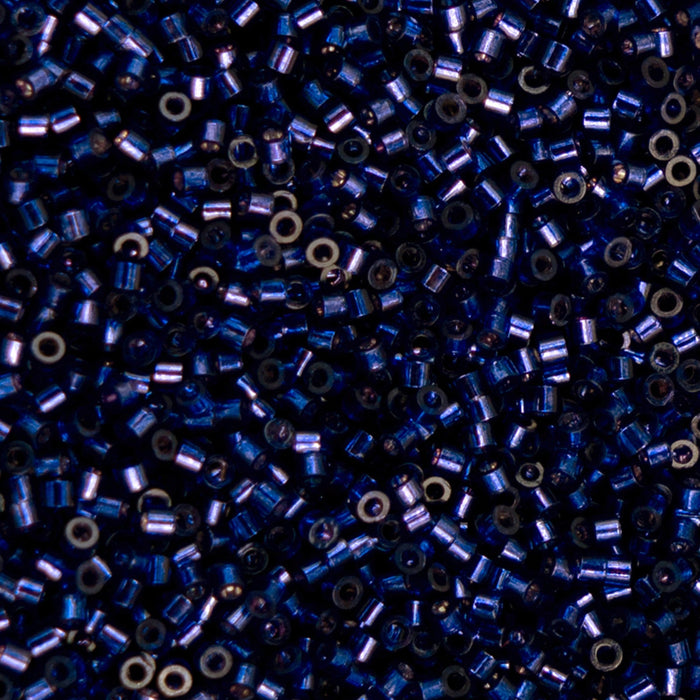Close-up of blue and silver beads on a black background