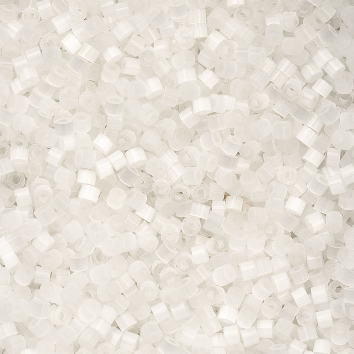 Close-up of small white beads on a light gray background
