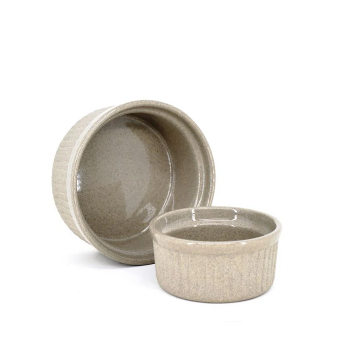 Two beige ceramic bowls on a white background