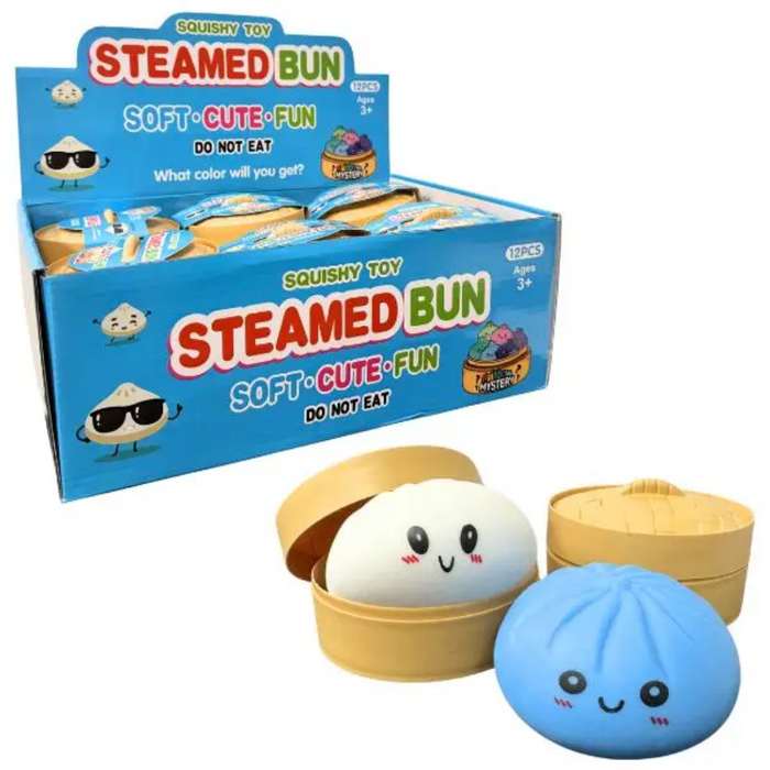 A retail display box and two squishy toy buns for kids. The display box is bright blue with 'STEAMED BUN' in large red and white letters.
