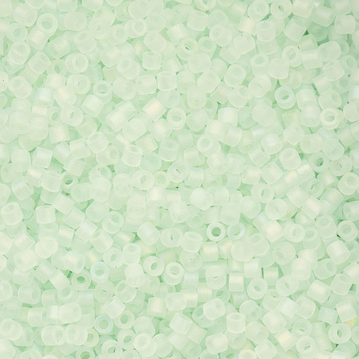 Close-up of light green beads on a green background