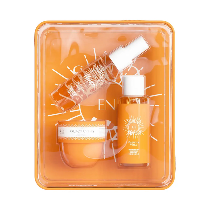 Skincare product set with bottles and a jar in an orange packaging tray.