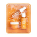 Skincare product set with bottles and a jar in an orange packaging tray.