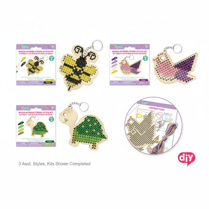 Wood keyring cross-stitch kits with completed designs on a white background, featuring a bee, butterfly, and turtle.