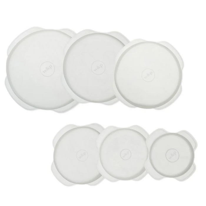 Set of white circular objects on a white background
