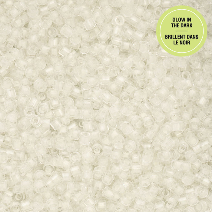 Close-up of small white beads with a green label on a beige background