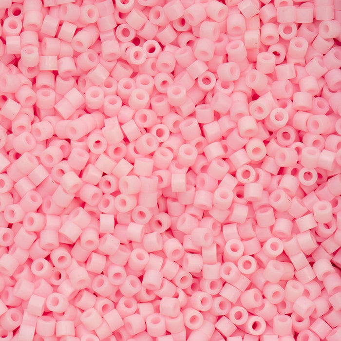 Close-up of pink plastic beads on a pink background