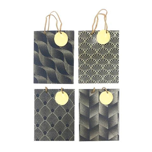 Four gift bags arranged in a 2x2 grid on a white background, each with a different black and gold geometric pattern and a round gold tag attached by twine.