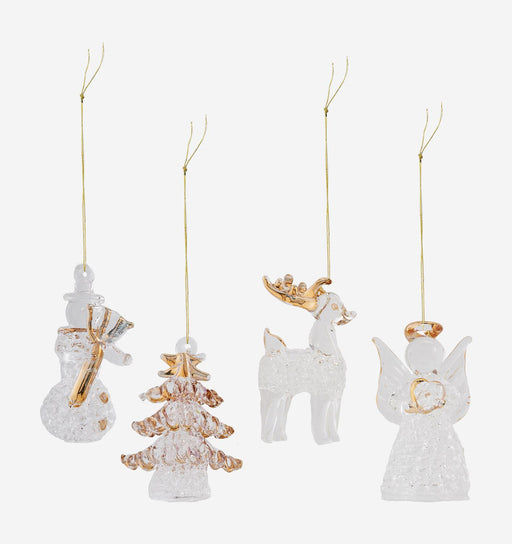Four clear glass Christmas ornaments with gold accents, including a snowman, Christmas tree, reindeer, and angel, hanging against a light gray background.
