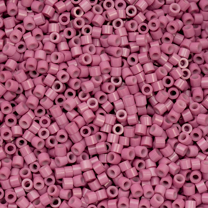 Close-up of pink beads with a pink background