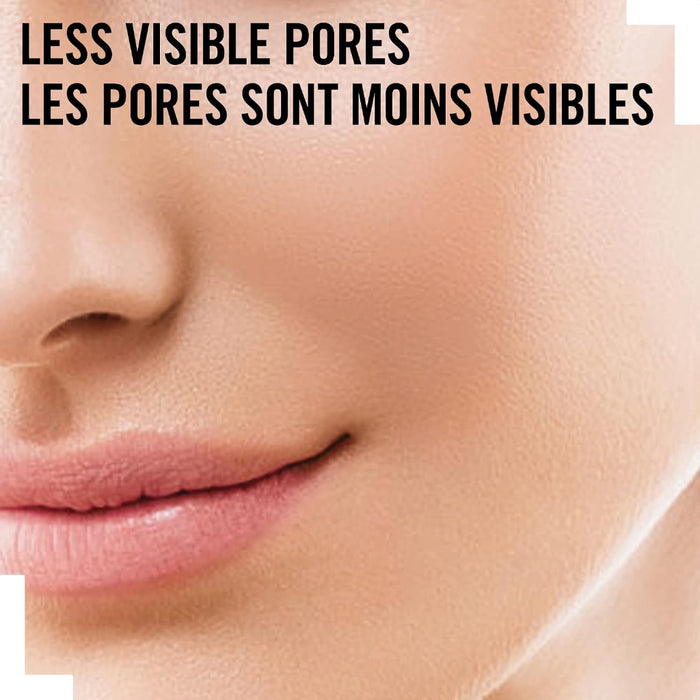 Close-up of a person's lower face with text at the top reading 'LESS VISIBLE PORES / LES PORES SONT MOINS VISIBLES' in black sans-serif lettering.