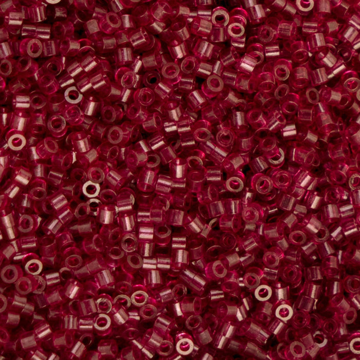 Close-up of red seed beads with a blurred background