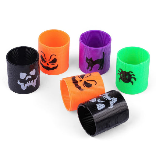 Six plastic spiral toy tubes in black, orange, purple, and green, each printed with a different Halloween-themed graphic including a skull, jack-o'-lantern, cat, spider, and ghost.