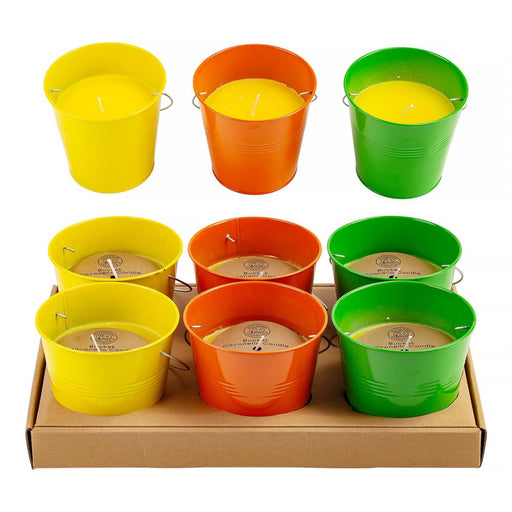 Set of colorful metal buckets with candles inside, displayed on a white background.